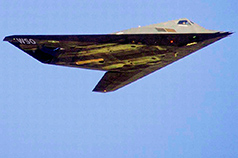 stealth jet in flight with W S O markings visible